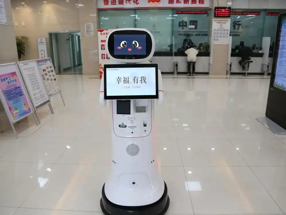 A friendly-looking banking robot with a touchscreen interface and card-reading capabilities, positioned in a bank lobby to facilitate automated customer transactions.