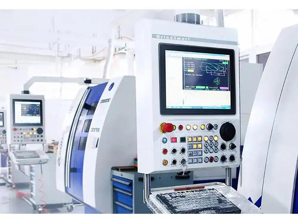 Close-up of a CNC machine control panel featuring a digital display with technical schematics, tool paths, and industrial control buttons.